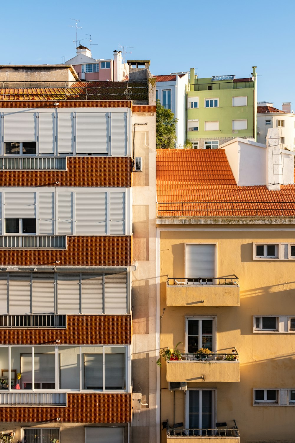 a row of buildings with balconies and balconies on top of them