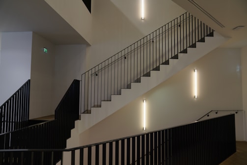 Elegant interior railing with matte black finish along a wooden staircase