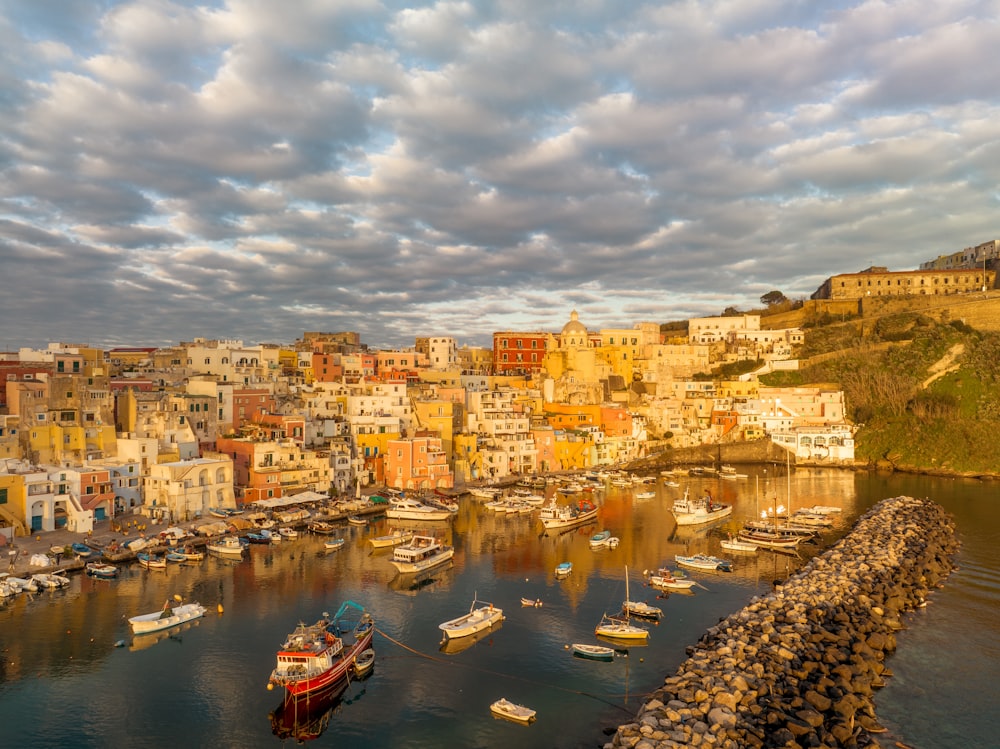 a harbor filled with lots of boats under a cloudy sky