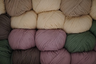 several skeins of yarn stacked on top of each other