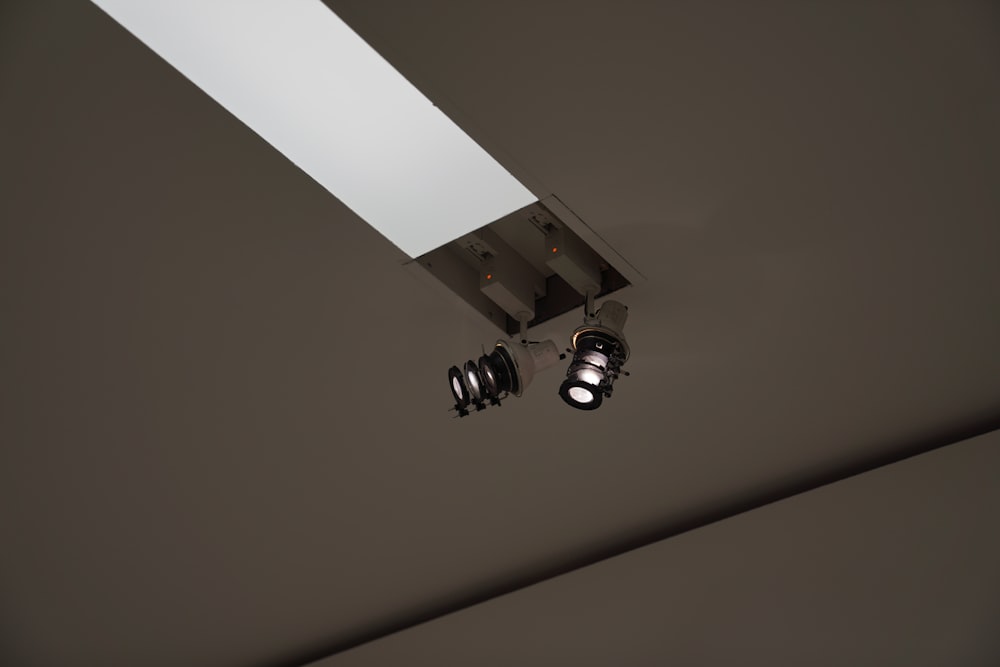 a couple of lights that are on a ceiling