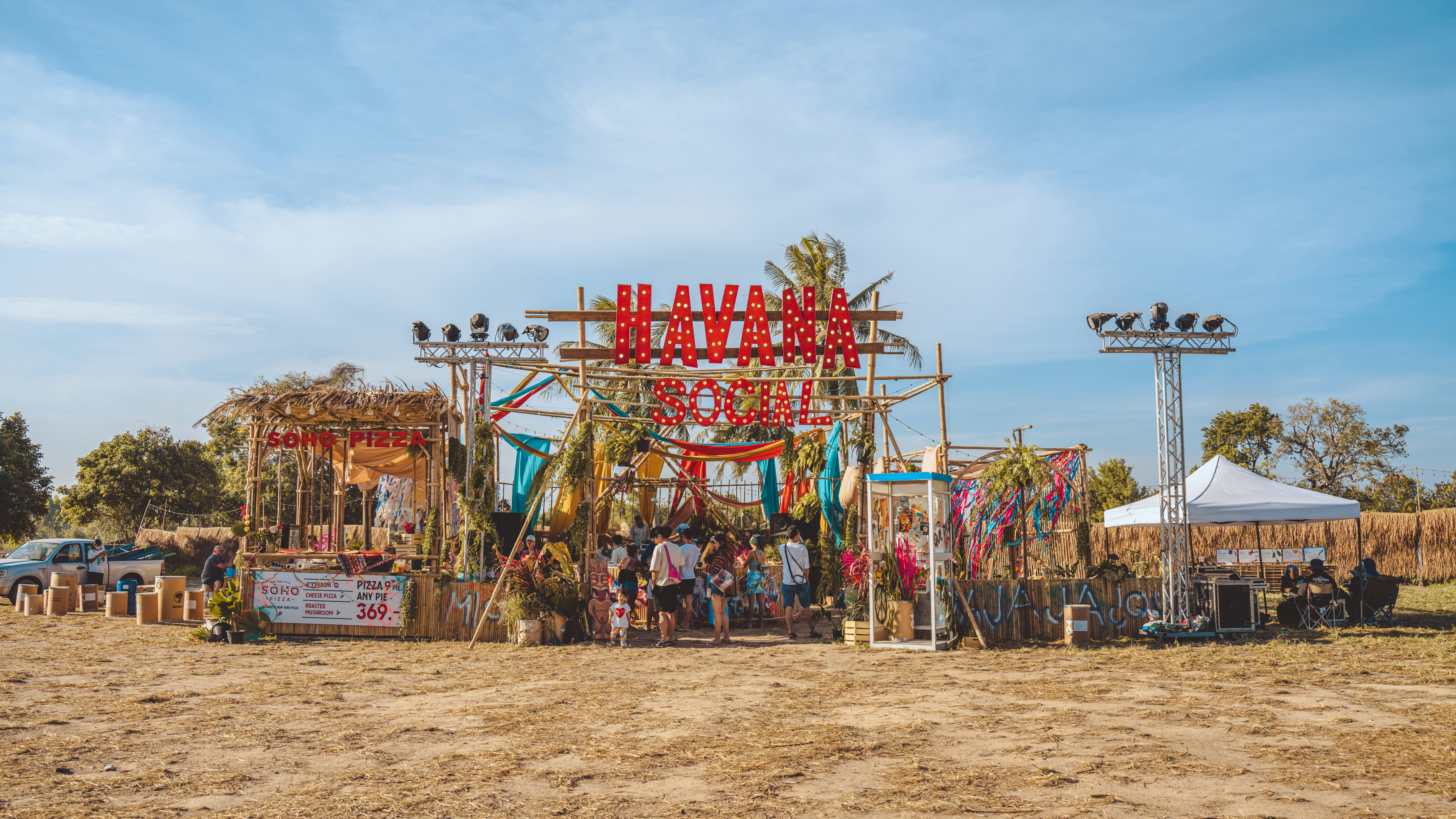 a group of people standing in front of a stage