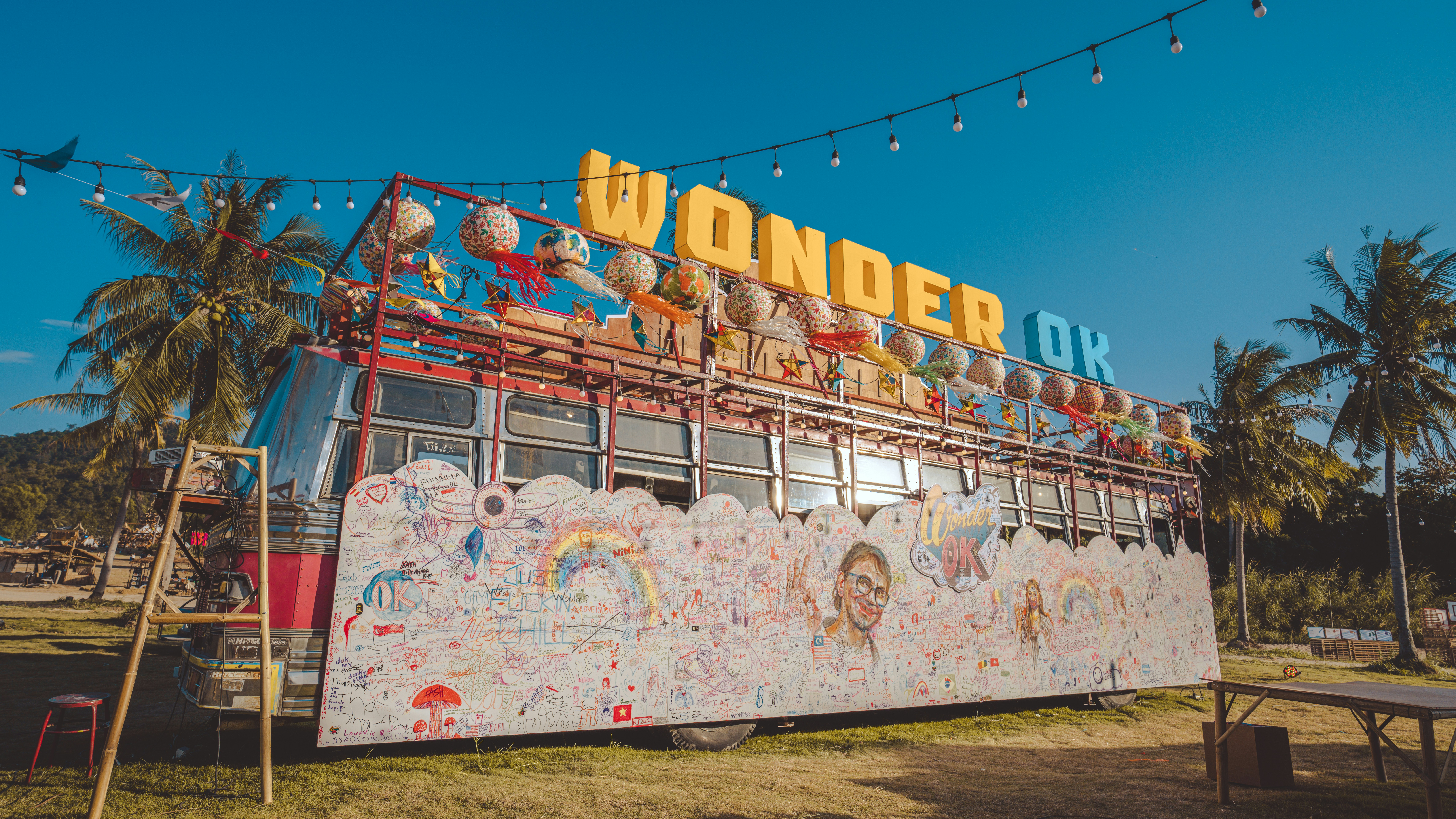 a double decker bus with a sign on top of it