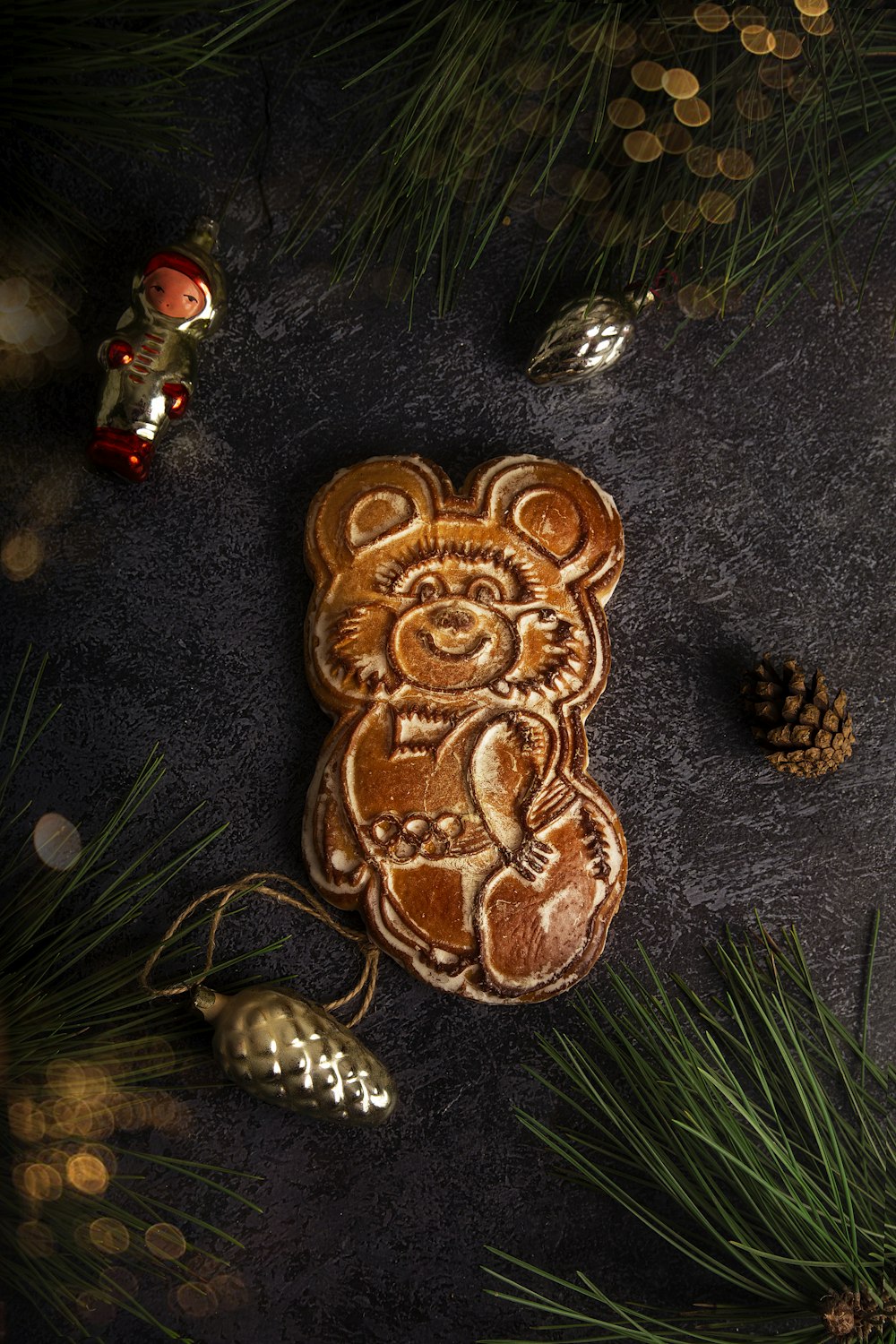 a cookie shaped like a bear on a table