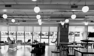 a black and white photo of a large room