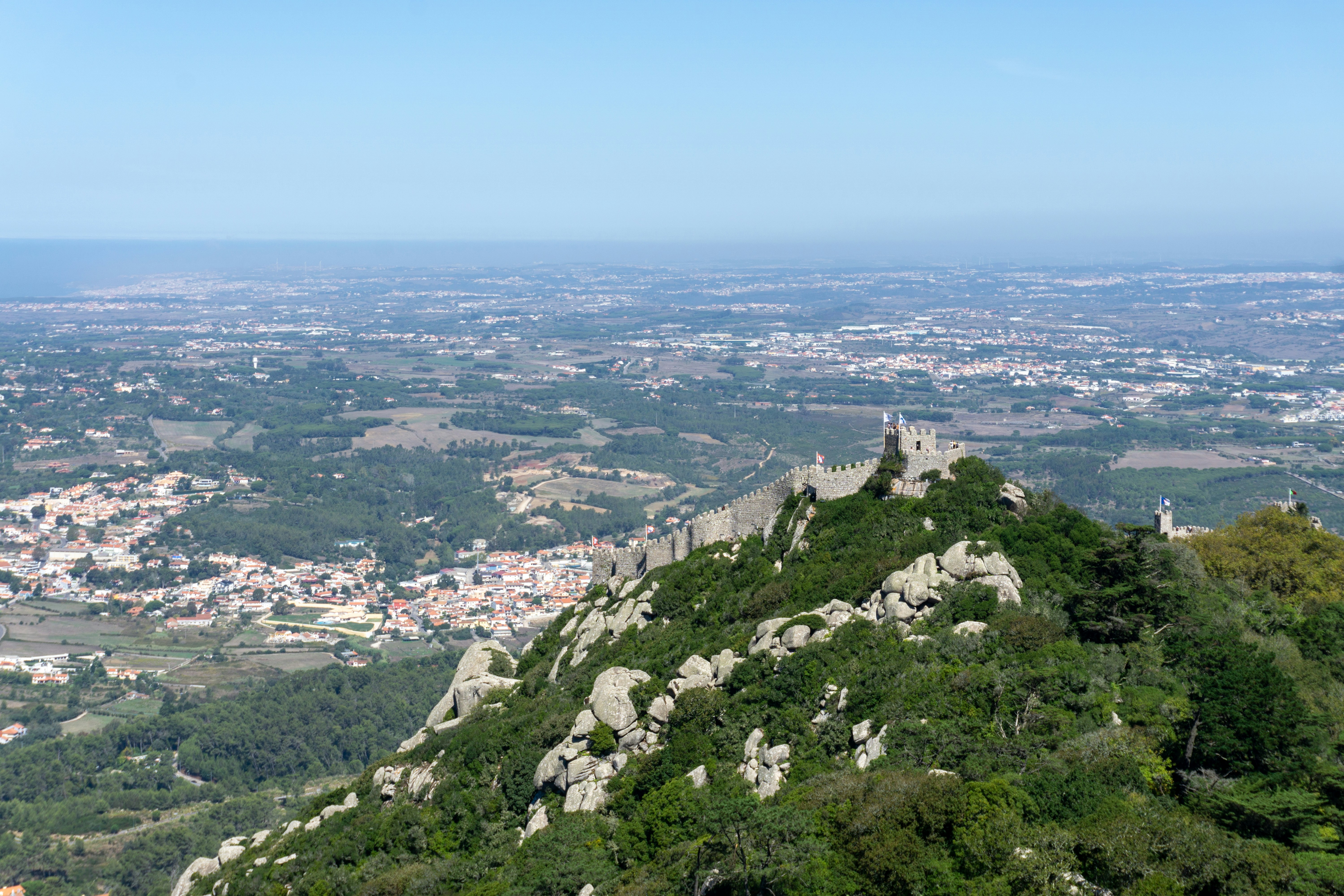 a view of a city from the top of a hill
