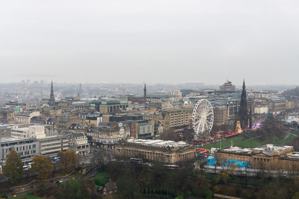 a view of a city with a ferris wheel