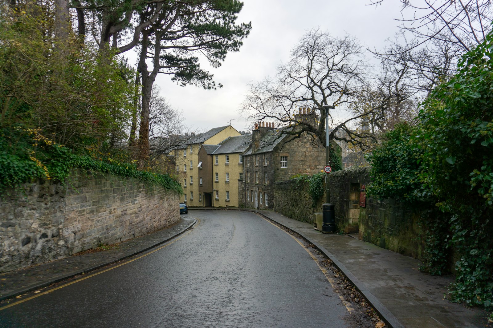 Stone building on a narrow British high street.