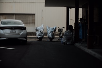 a car parked in a parking lot next to a building