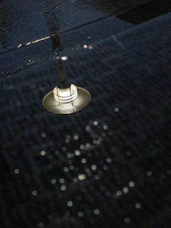 Installation process of material pop elements under soft dark lighting