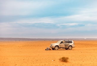 a car parked in the middle of a desert