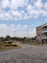 Finished urbanization project with green spaces and pedestrian pathways in a sunny Chiapas neighborhood.