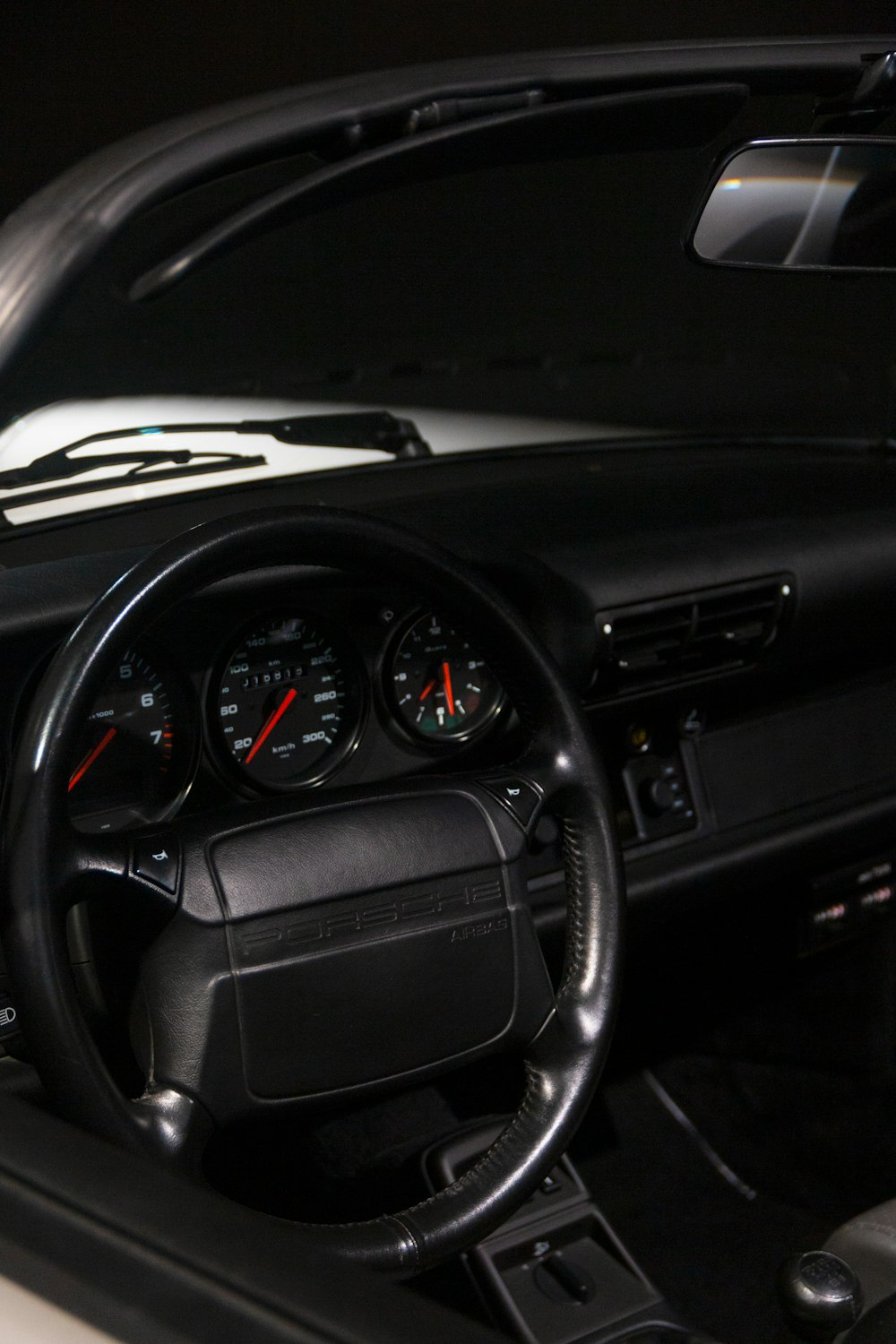 a car dashboard with a speedometer and gauges