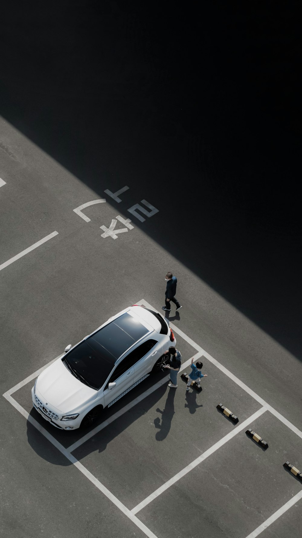 a white car parked in a parking lot