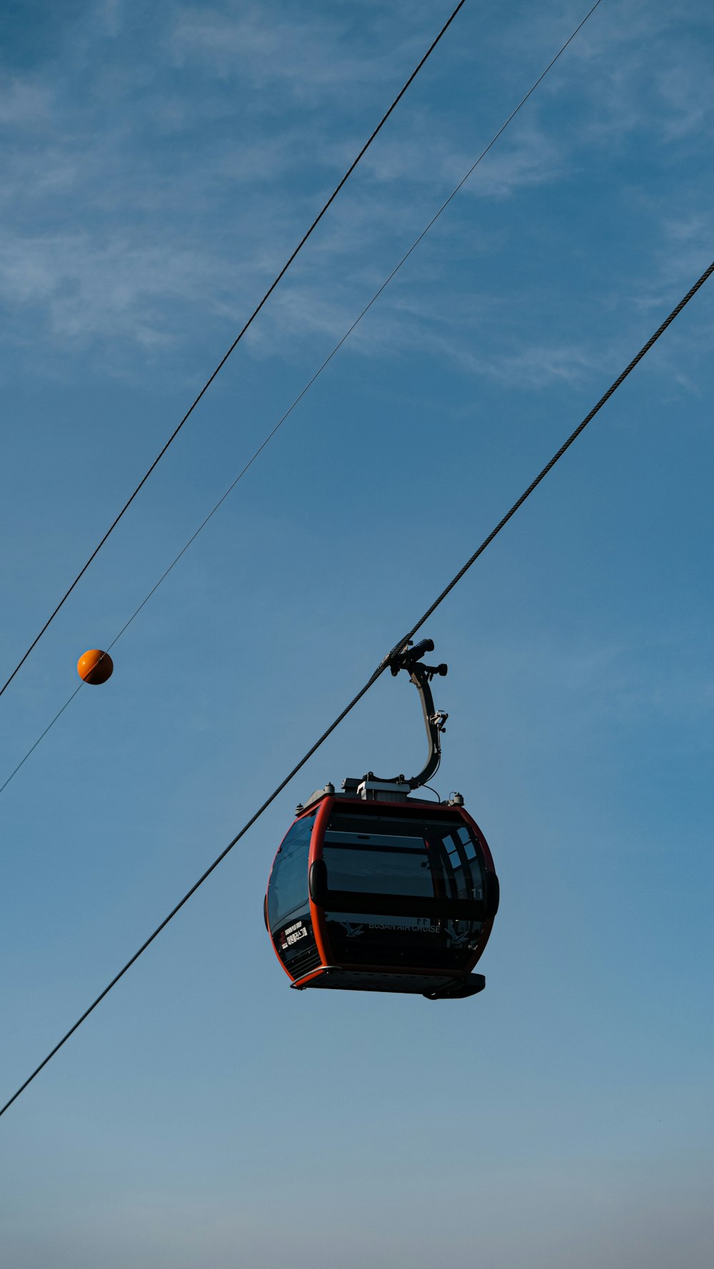 a cable car with a ball in the air