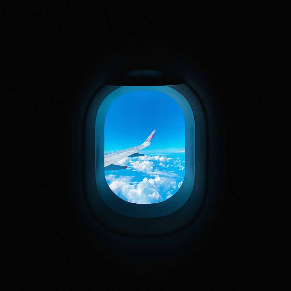 a view of the wing of an airplane through a window