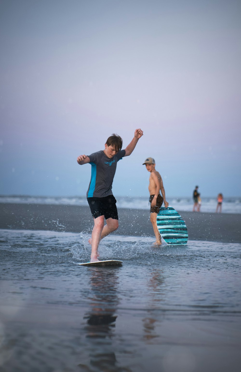 a man riding a surfboard on top of a body of water