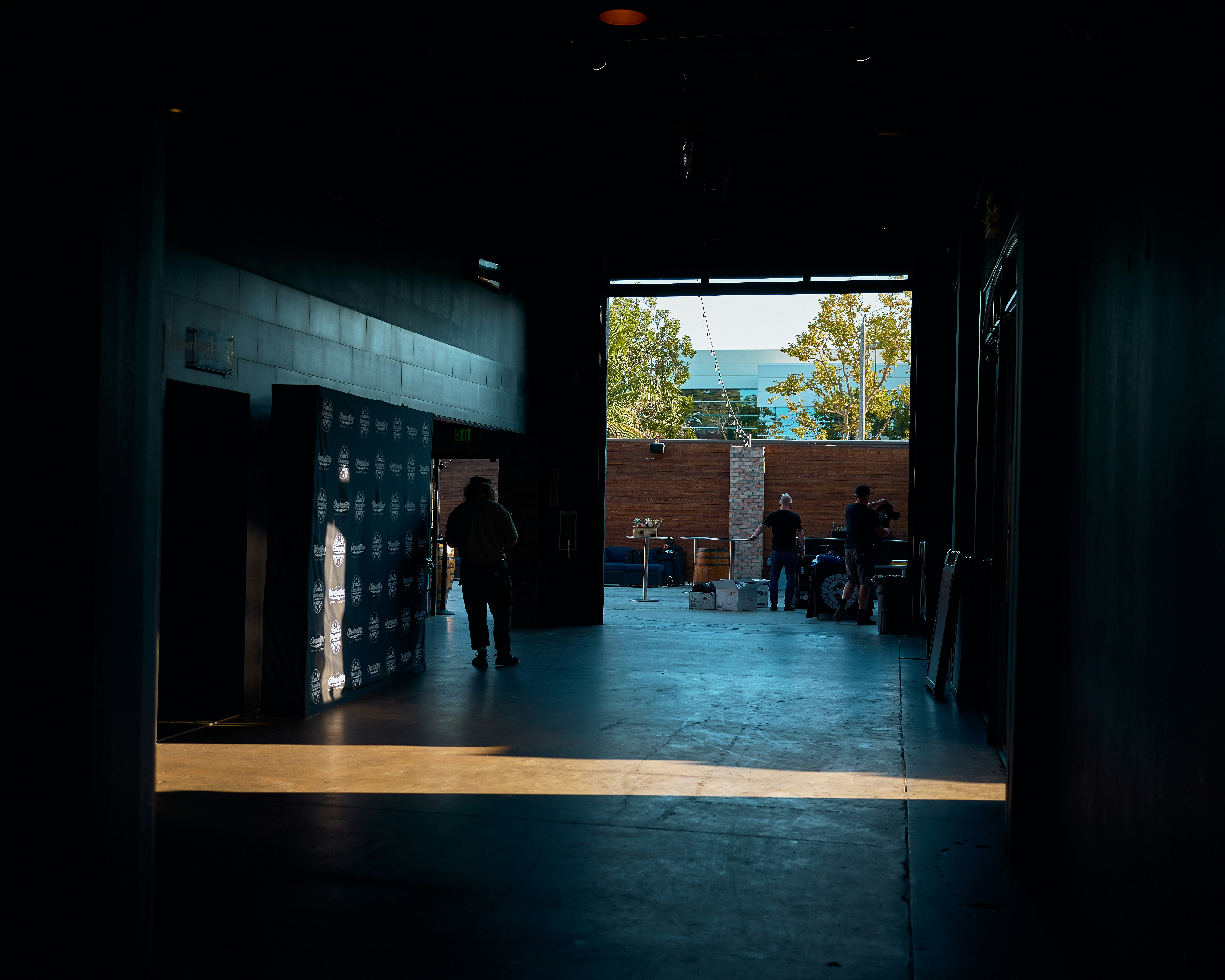 a group of people standing inside of a building