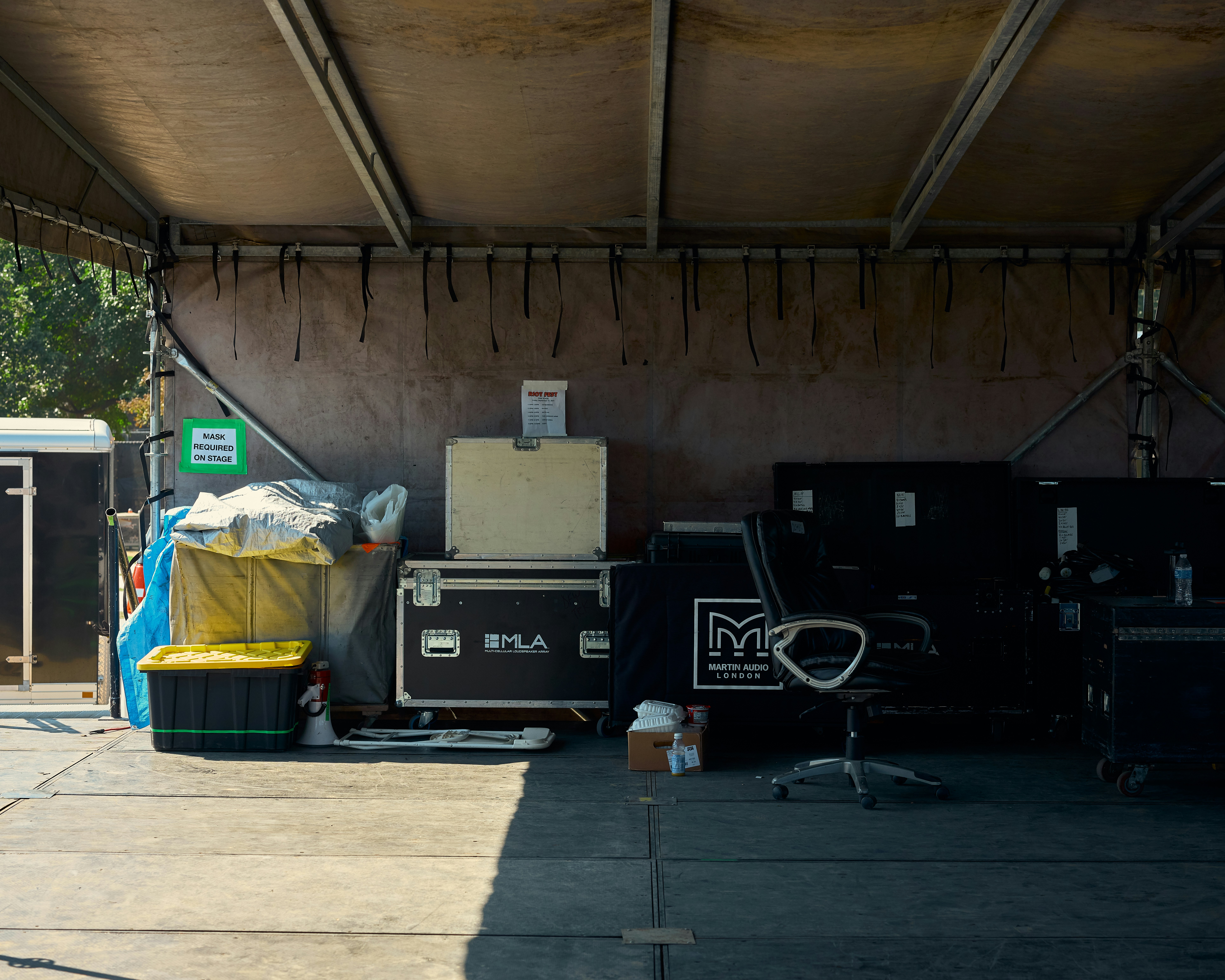 a group of luggage bags sitting under a roof