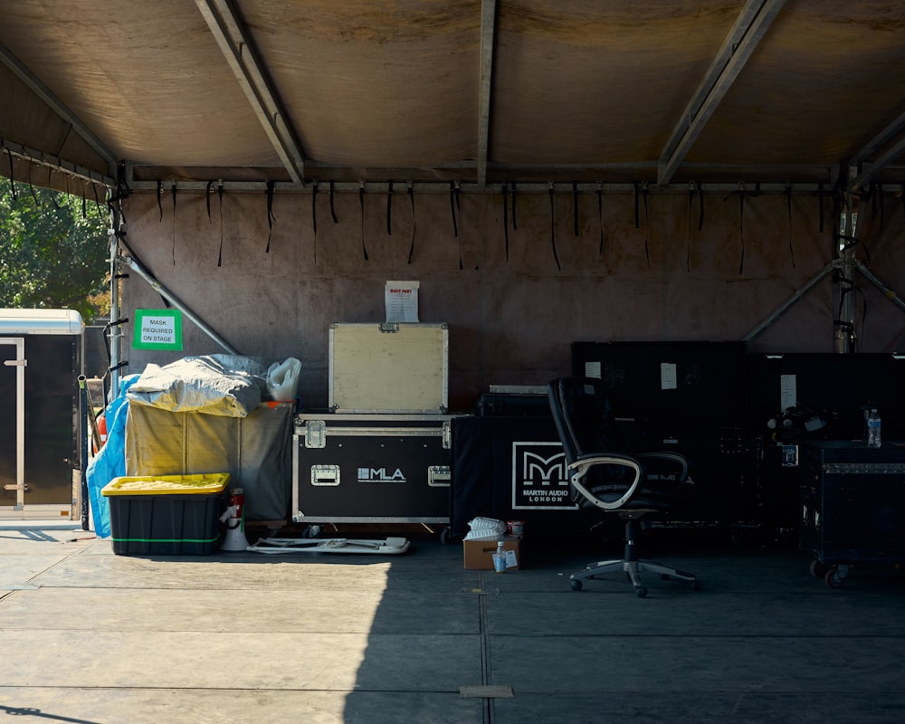 a group of luggage bags sitting under a roof