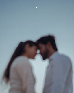 Two figures gently exchanging cups beneath a glowing crescent moon, surrounded by soft, swirling mist.