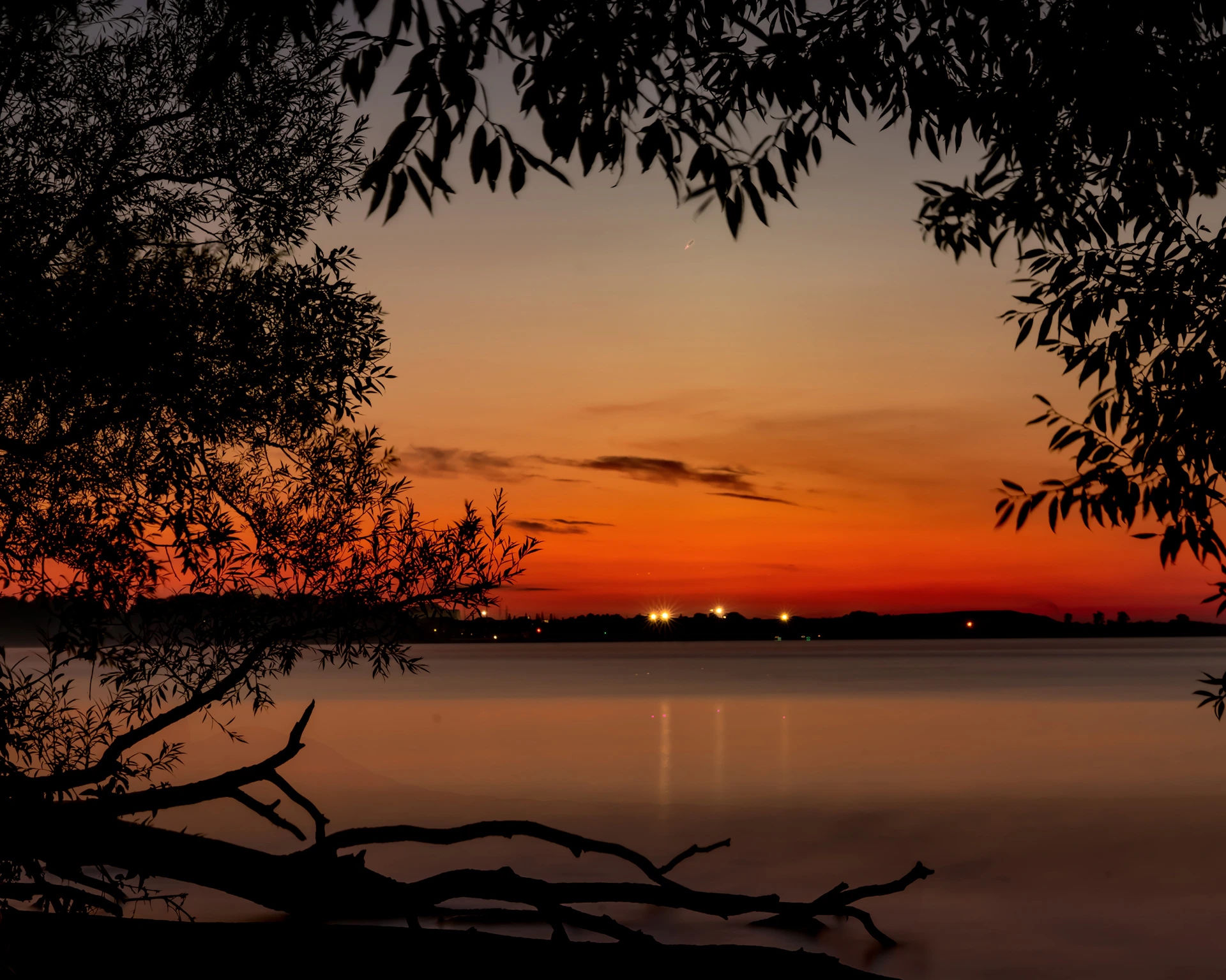 woman wearing yellow long-sleeved dress under white clouds and blue sky during daytime