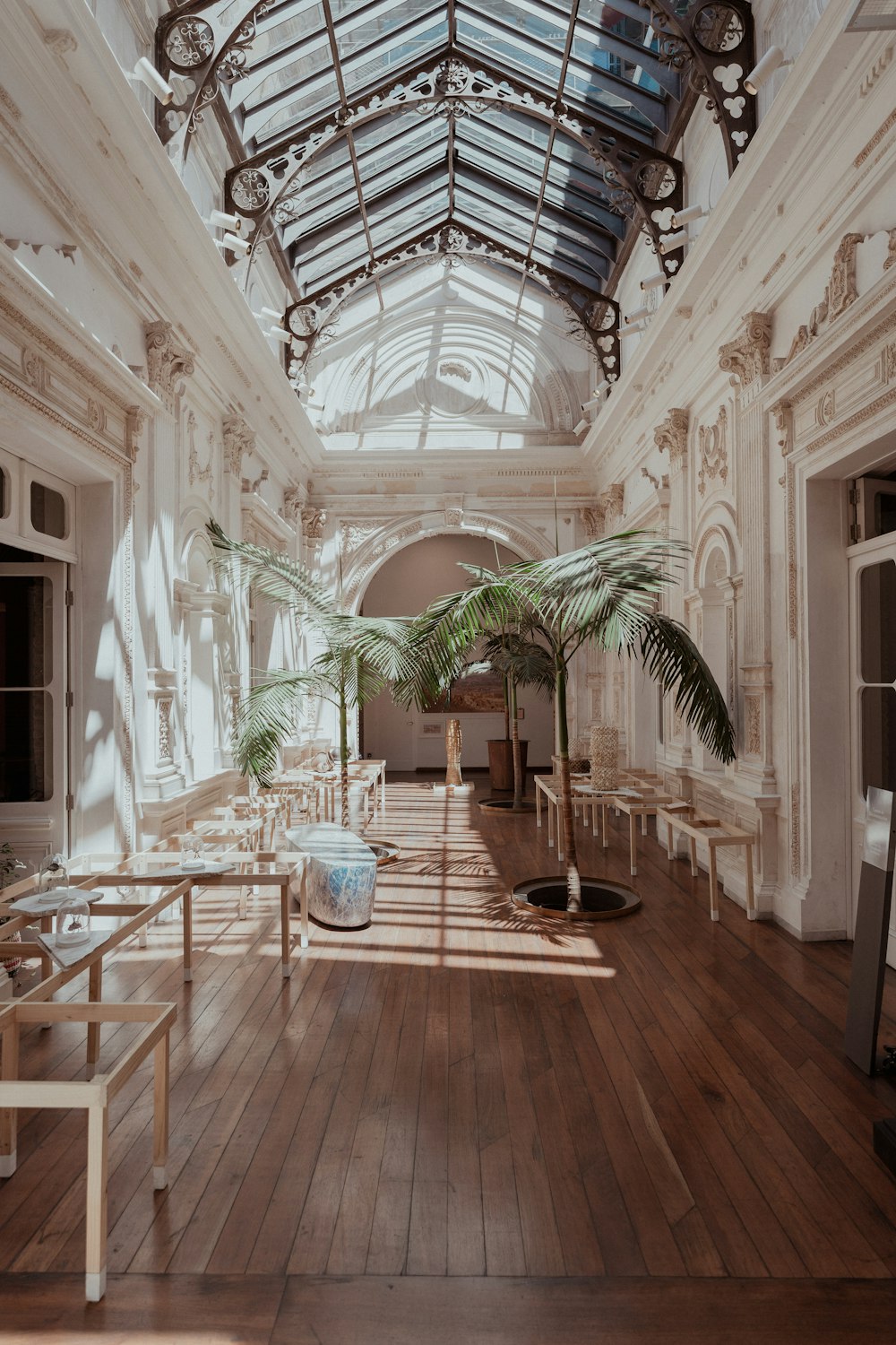 a room filled with lots of furniture and a skylight