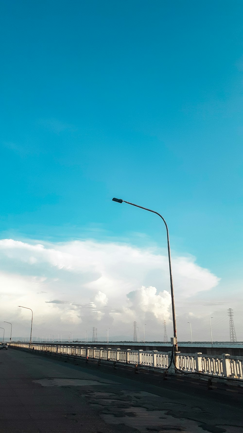 a street light sitting on the side of a road