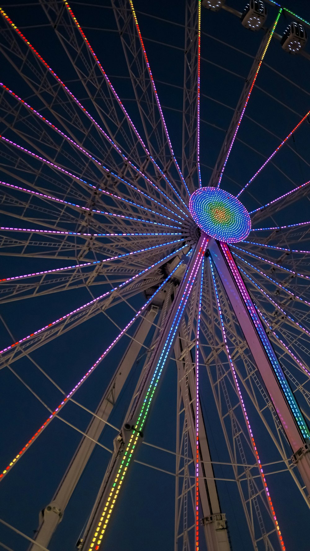 a ferris wheel lit up with multicolored lights