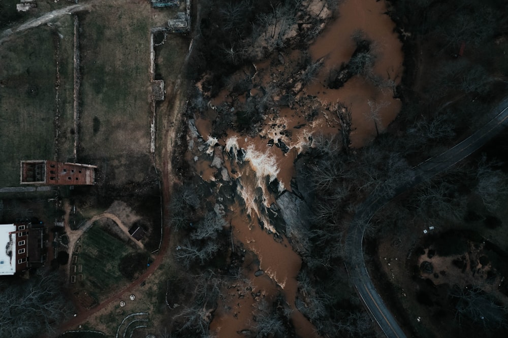 an aerial view of a house surrounded by trees