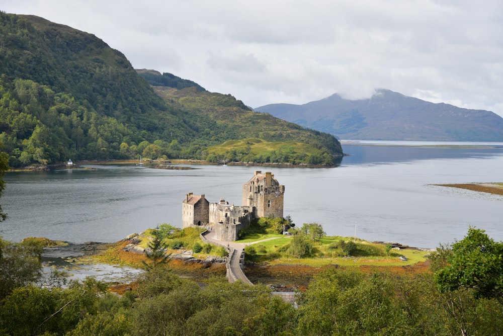 a castle on a small island in the middle of a lake