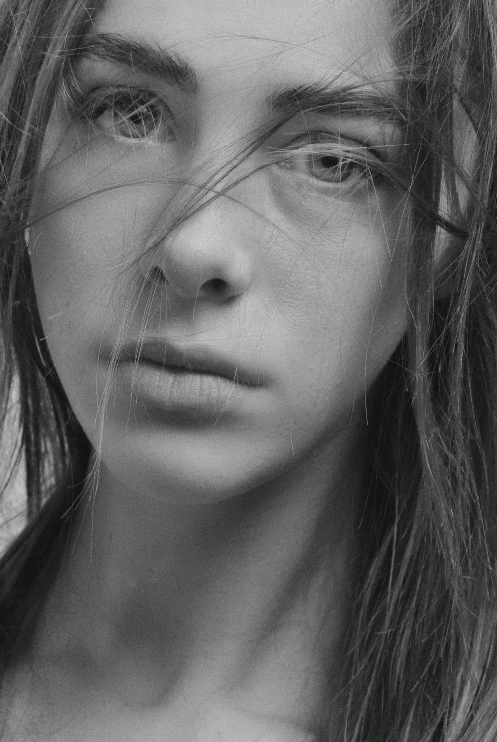 a black and white photo of a woman's face