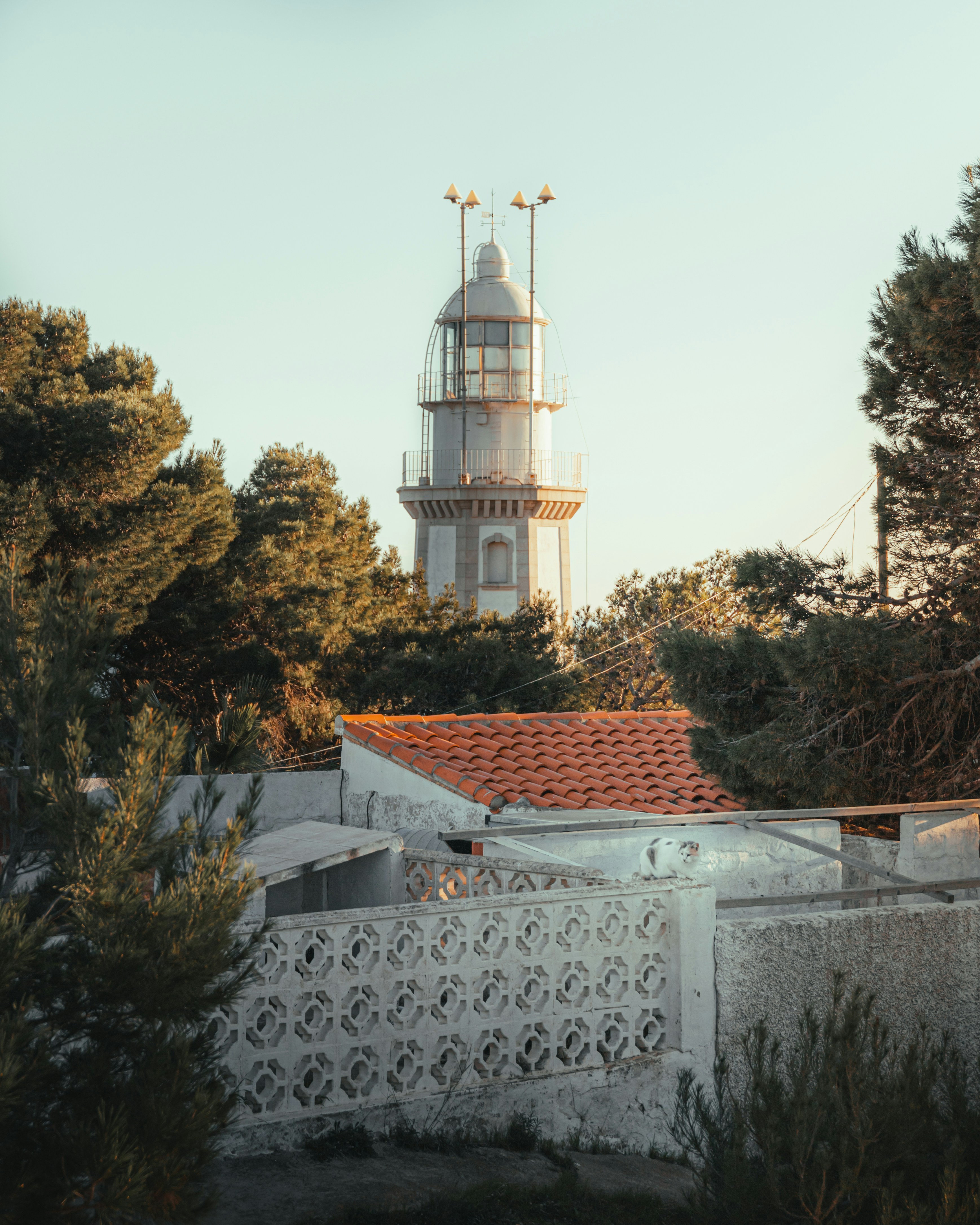 a white lighthouse on top of a white building