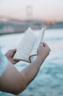 a person holding a book in their hands