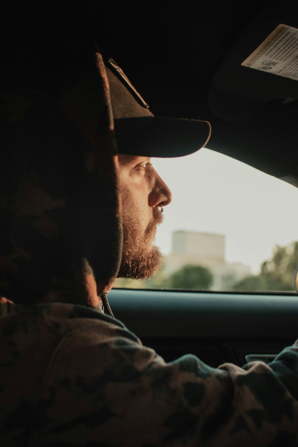 a man driving a car with a woman in the passenger seat