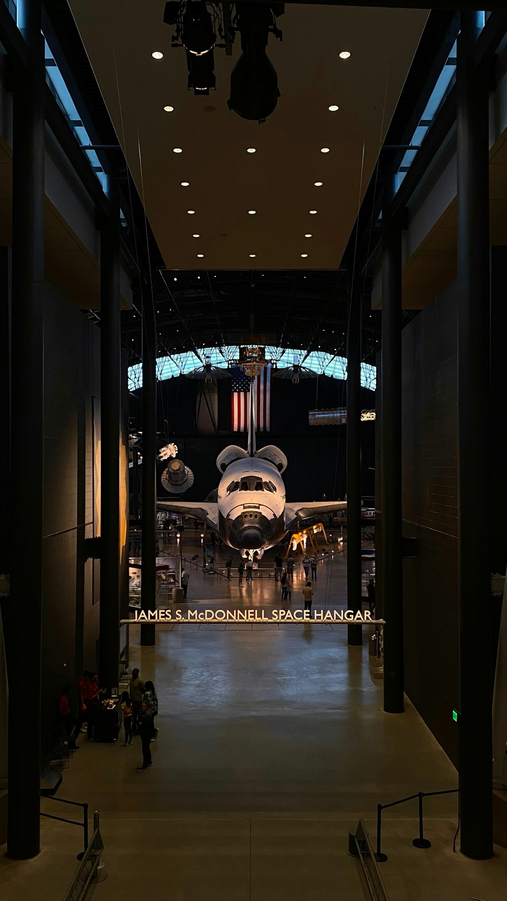 a large space shuttle sitting on top of a museum floor