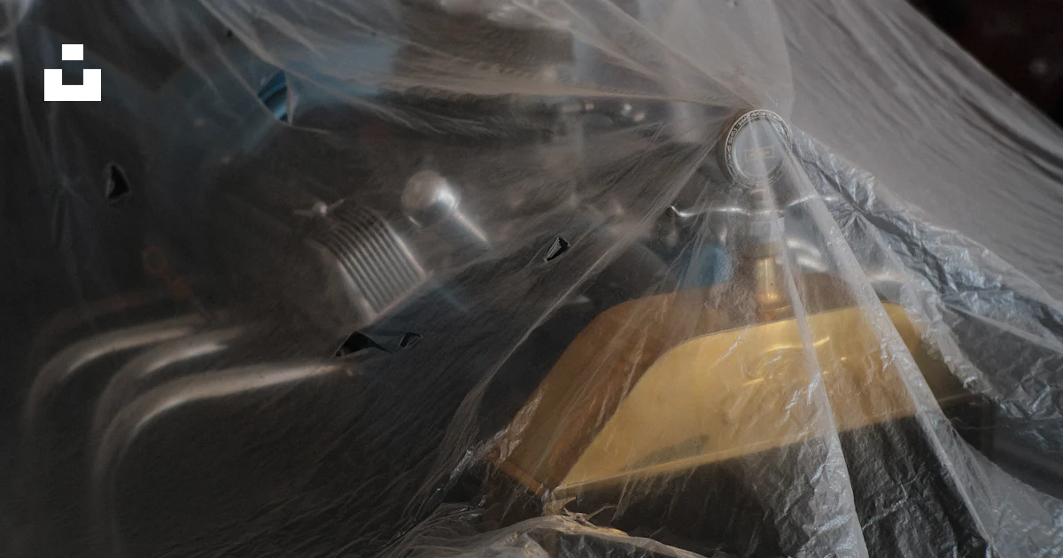 A yellow and black object wrapped in plastic photo – Free Car show ...