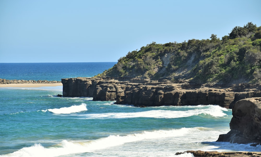 a view of the ocean from a rocky cliff