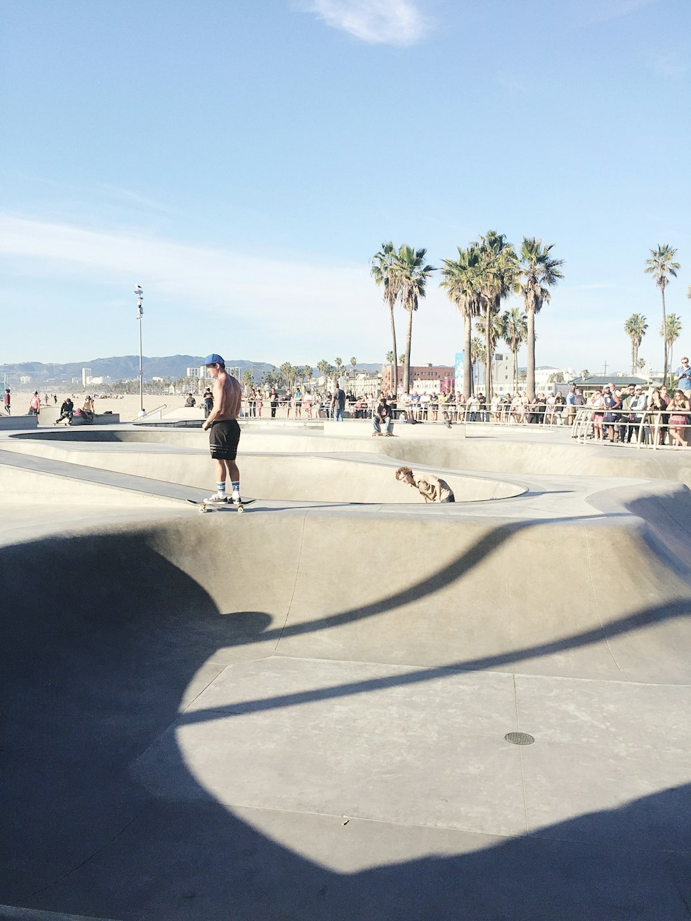 a man riding a skateboard at a skate park