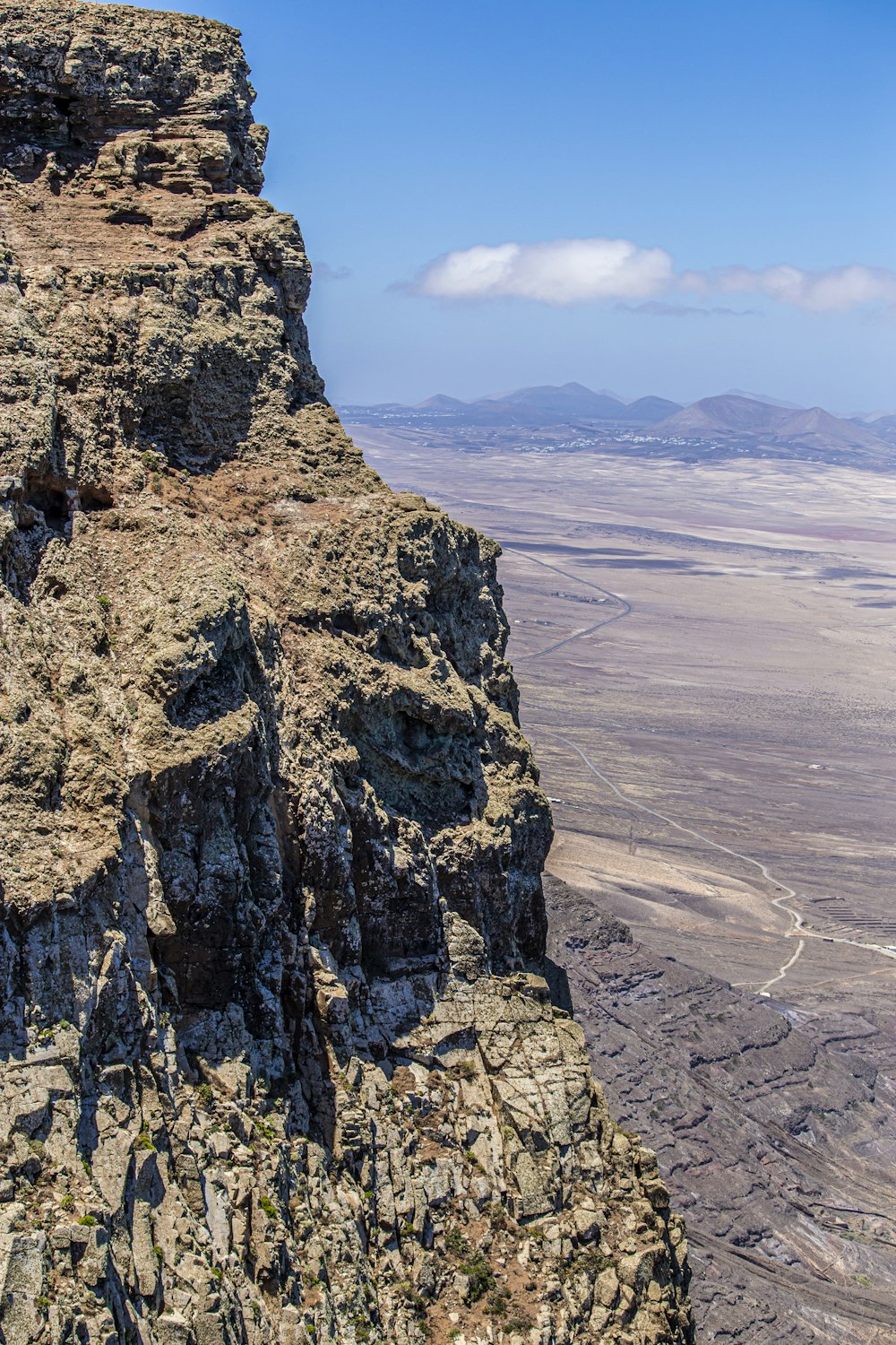 a person standing on top of a rocky cliff