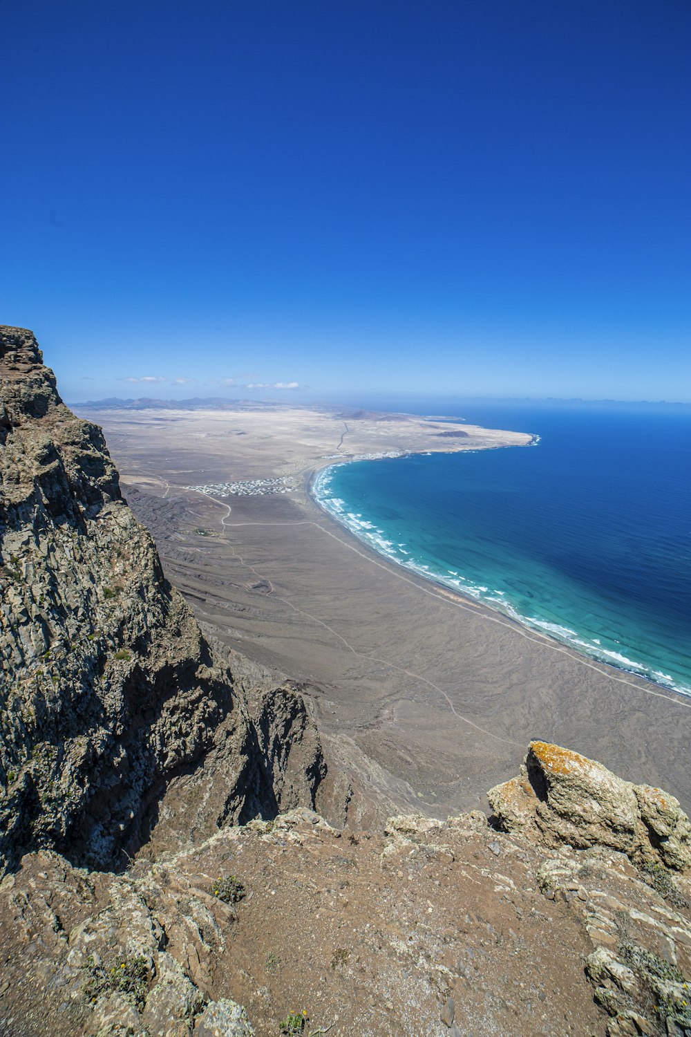 a view of the ocean from a high cliff