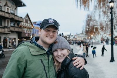 Snow-covered Canadian neighborhood with people walking cheerfully in winter coats.