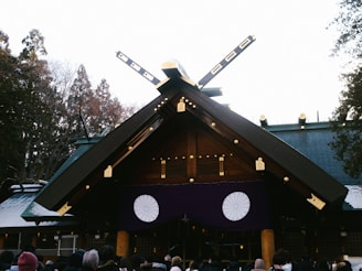 a group of people standing in front of a building