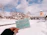 Smiling traveler holding a ticket with a scenic Tamarassery background.