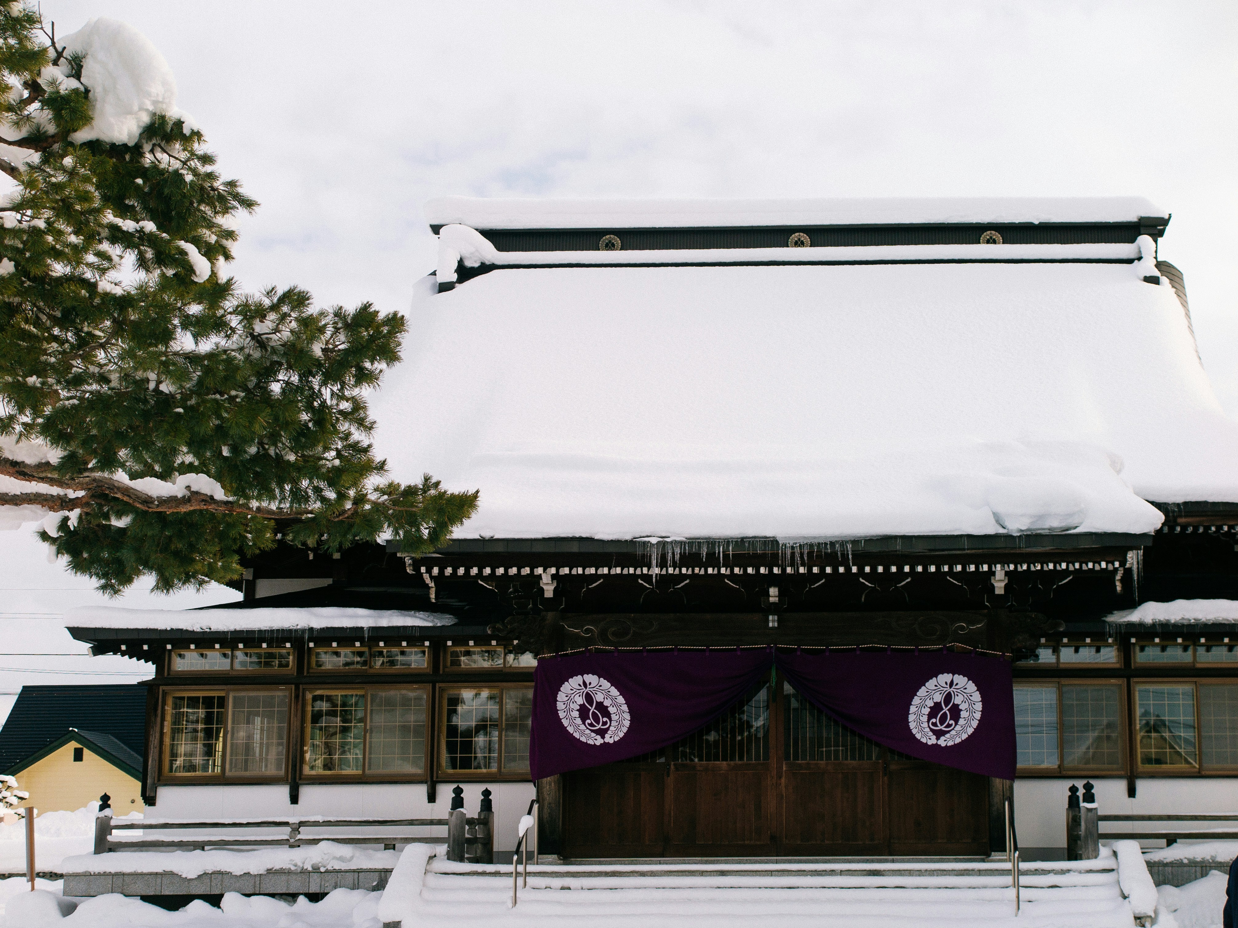 Kusatsu Onsen Yubatake in winter with steam, traditional Japanese outdoor onsen snow