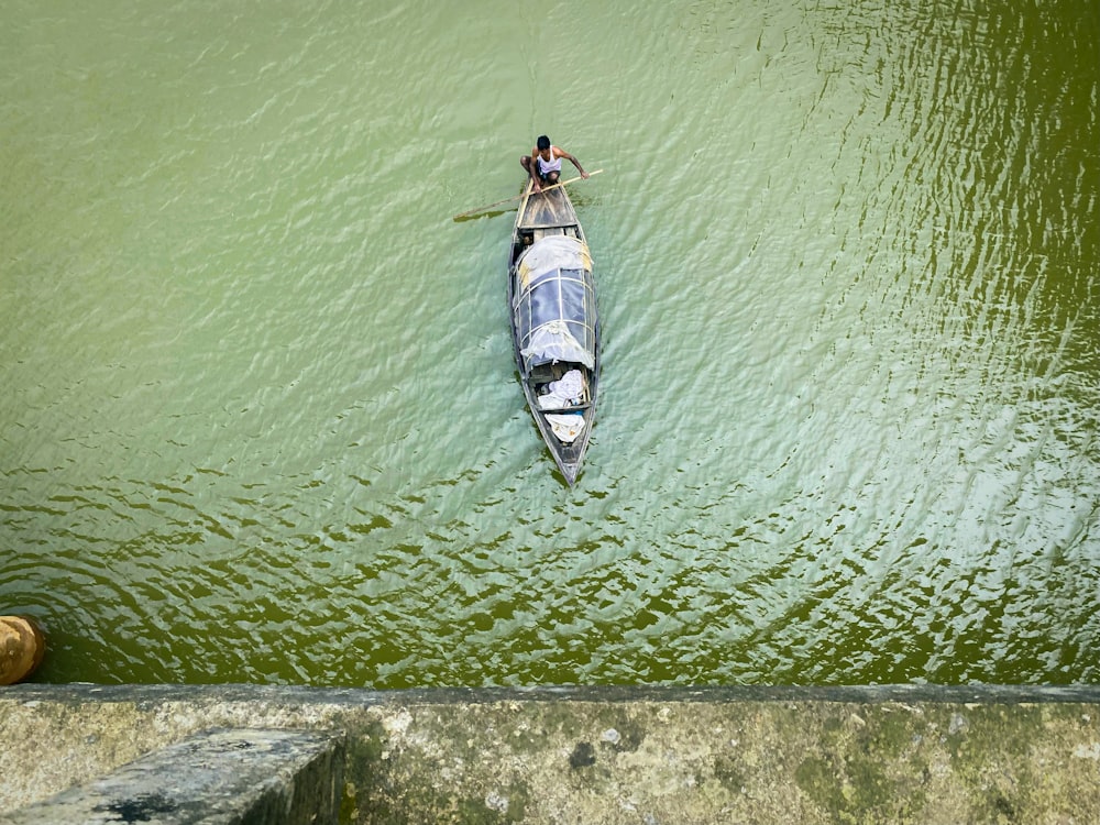 a person in a boat on a body of water
