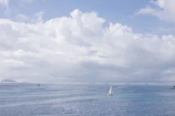 A serene scene of a sailor connecting with family via video call onboard.