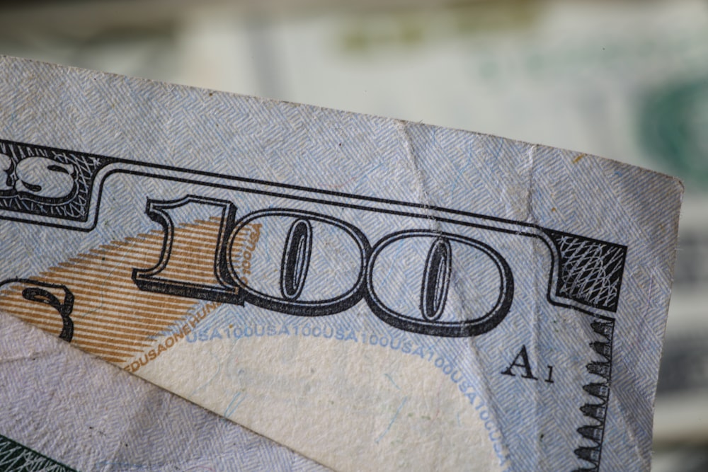 a close up of a hundred dollar bill