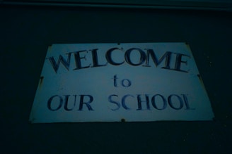 A welcoming school entrance decorated with banners for new students.
