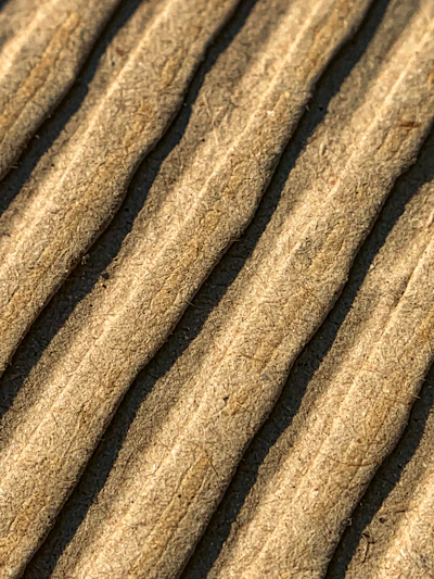 Premium quality cardboard plate with a subtle texture, photographed on a white background